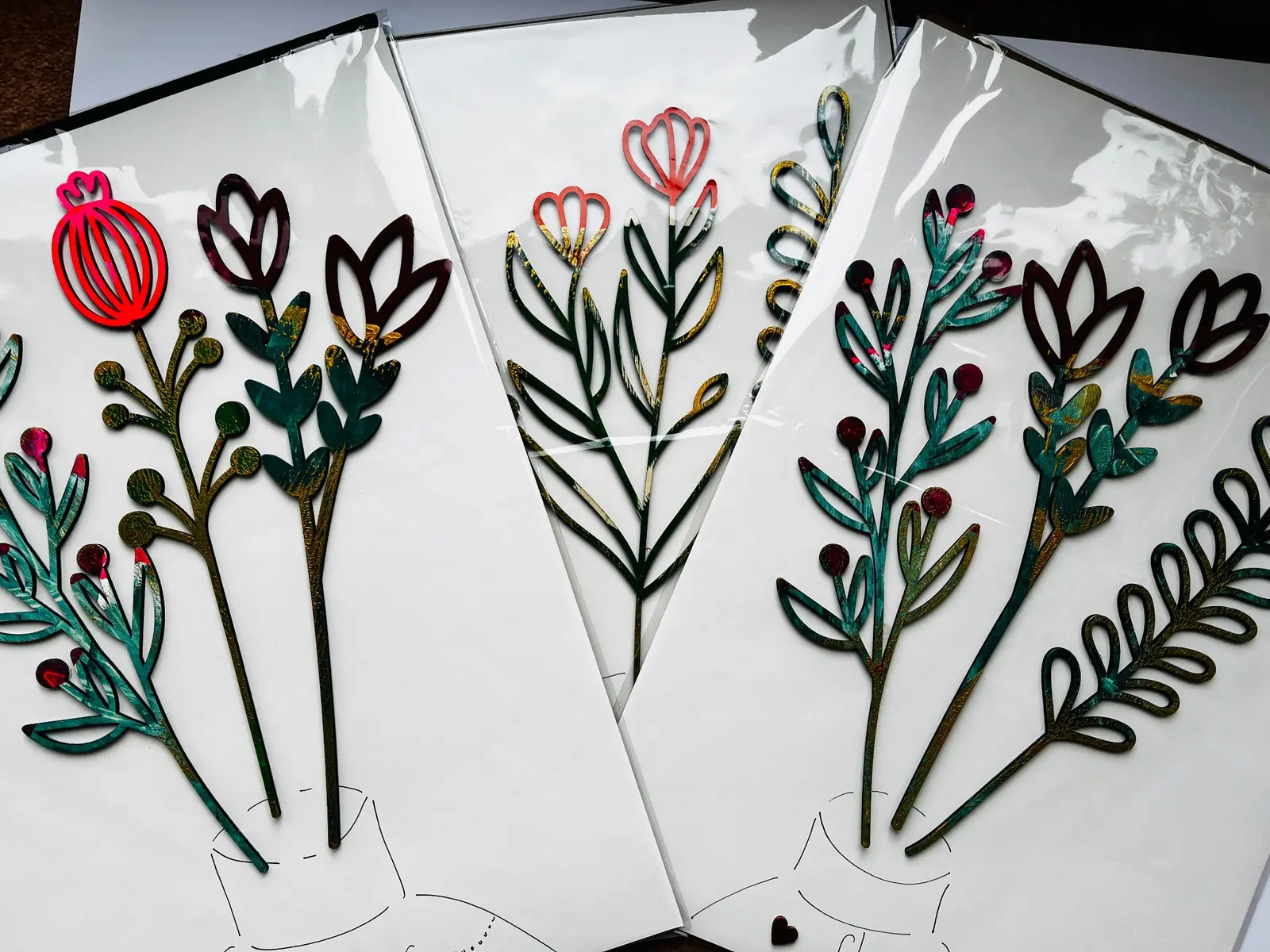 A selection of handmade cards with gelli printed wooden flower stems.