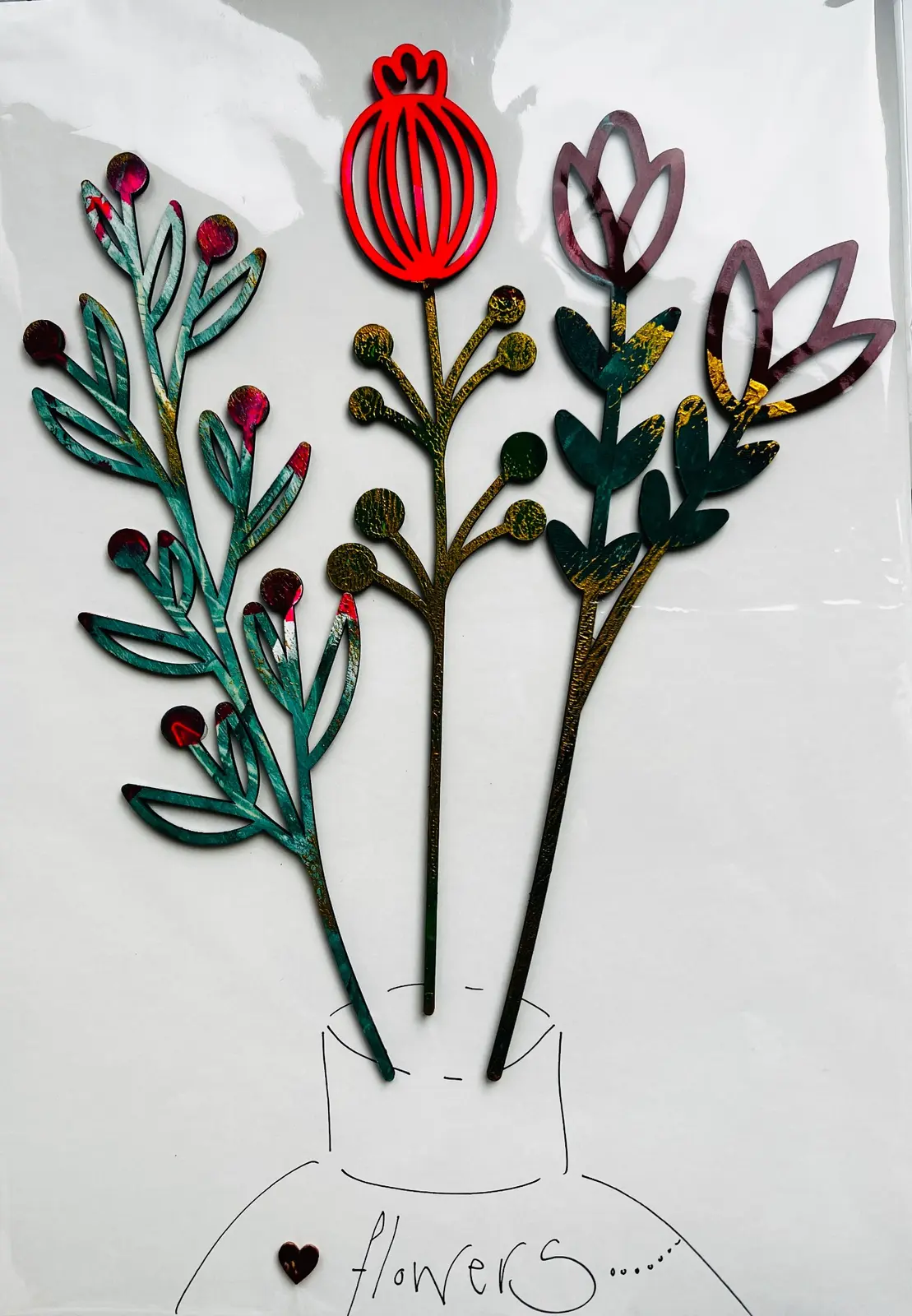 Three tall gelli printed wooden botanical stems in a hand-drawn vase.