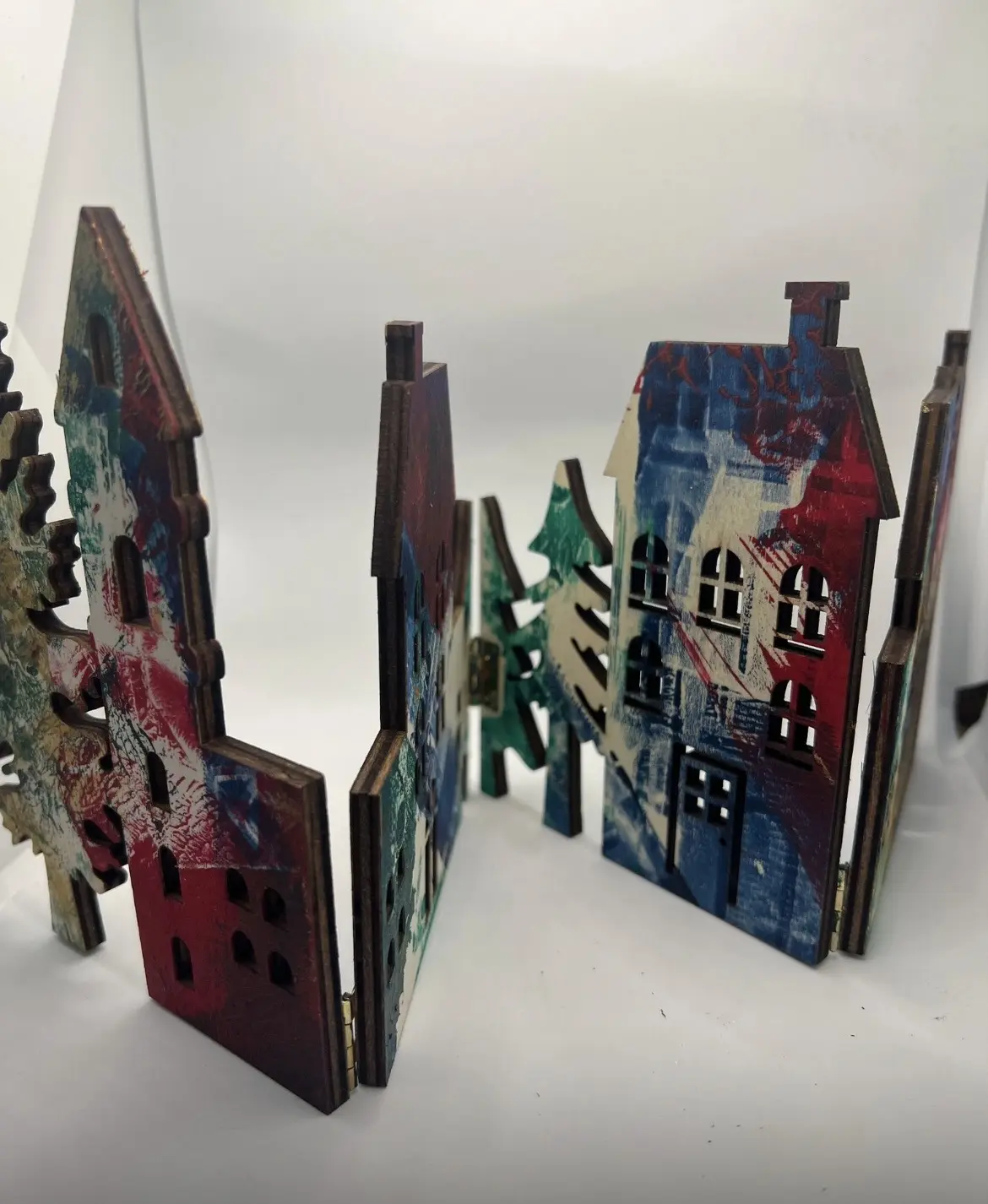 Handmade house forms viewed along a miniature street.