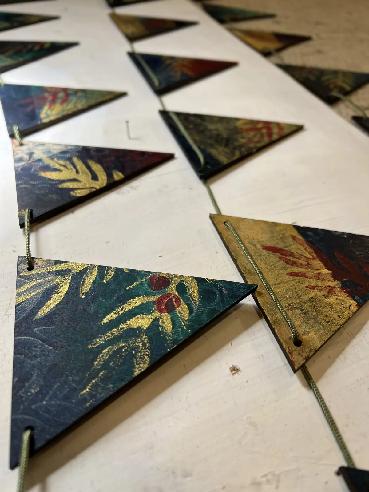 Printed triangular bunting displayed on a wall.